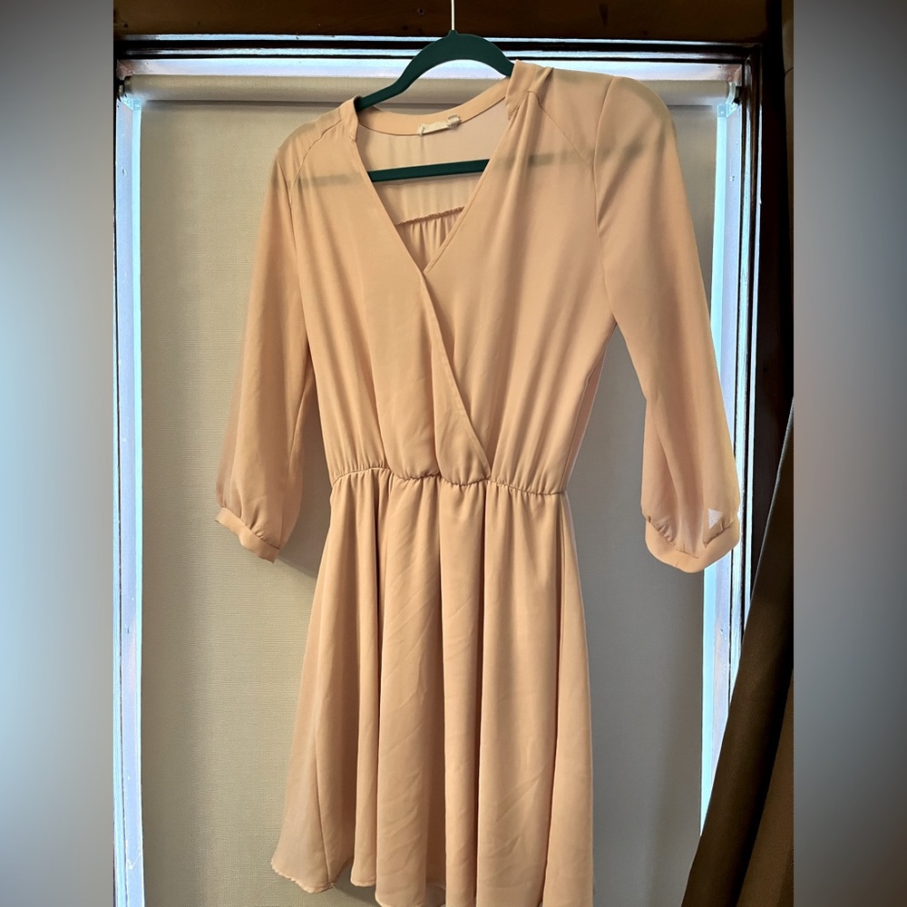 Blush nude 3/4 sleeve faux wrap dress hits above knee